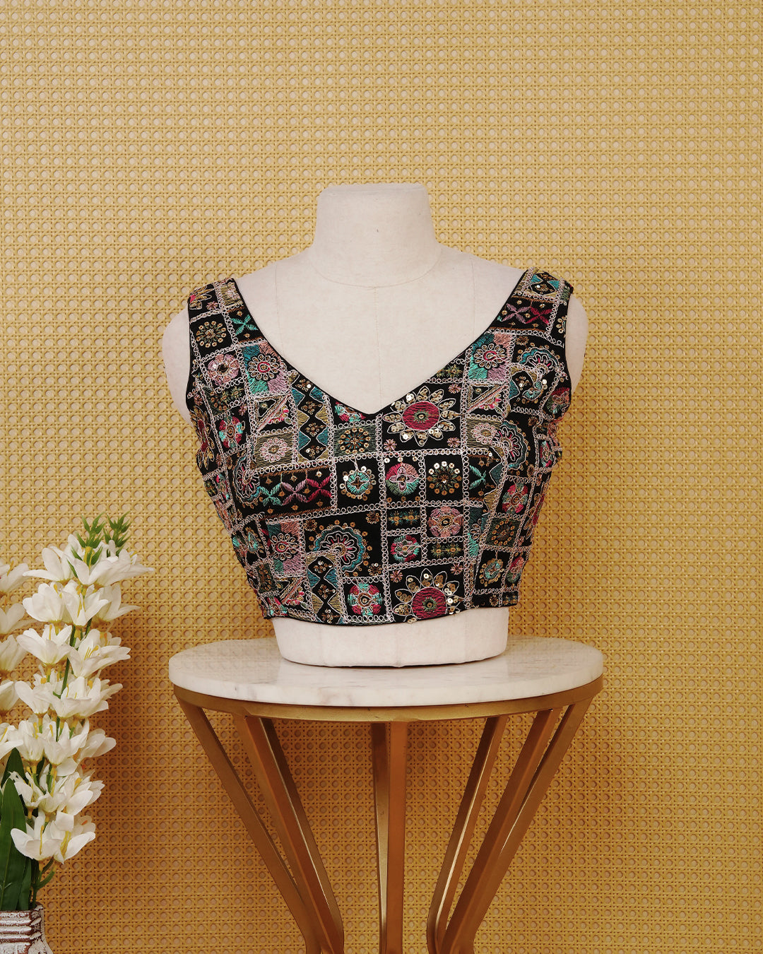 Black colour Sleeveless Blouse Featuring A Classic V-Neck, Intricate Multicolour Embroidery With sequin Detailing, And A Comfortable Tailored Fit