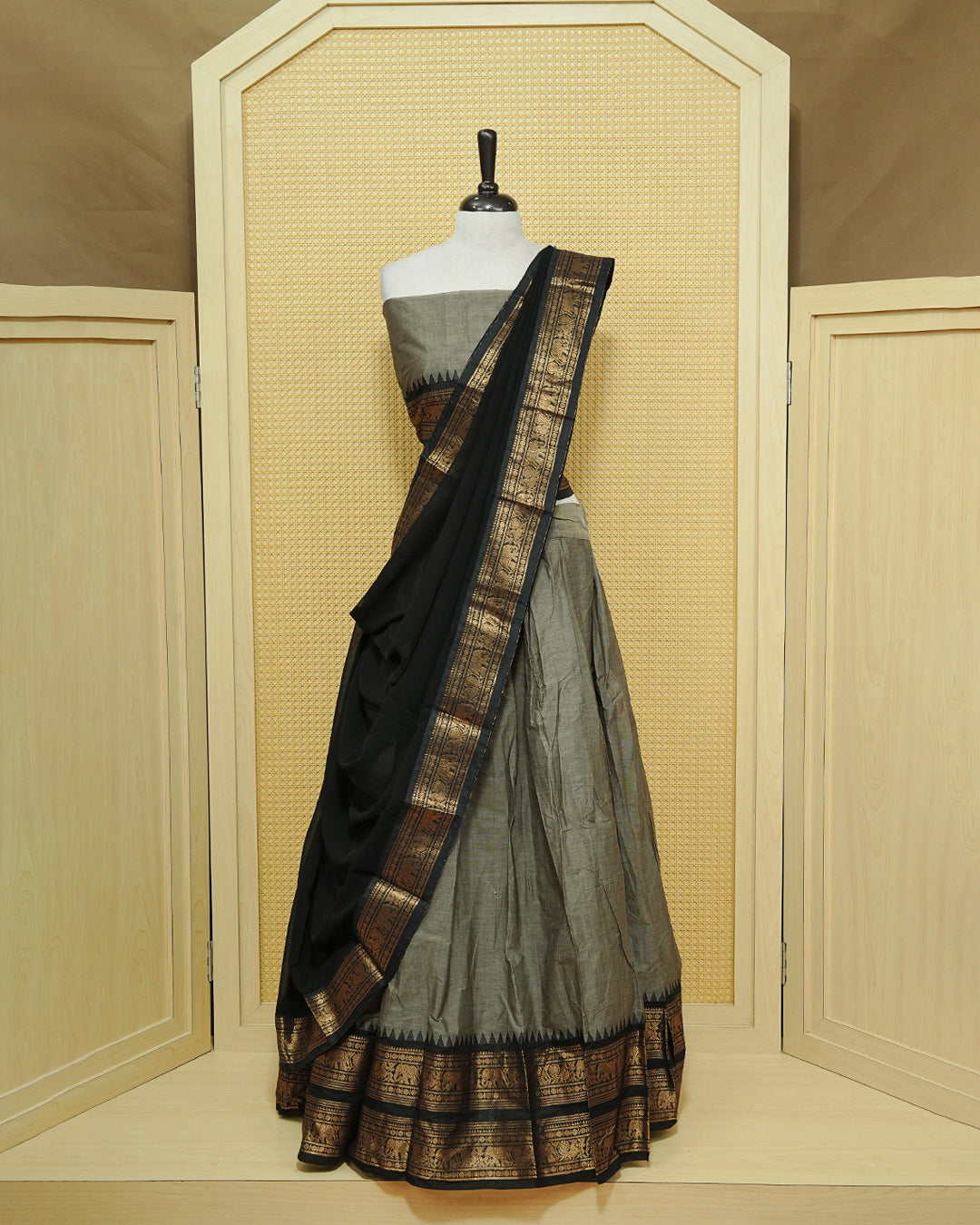 Grey colour Chettinad Semi Stitched dhavani set Featuring contrast Black with Gold zari border on skirt, Contrast Blouse & matching dupatta.