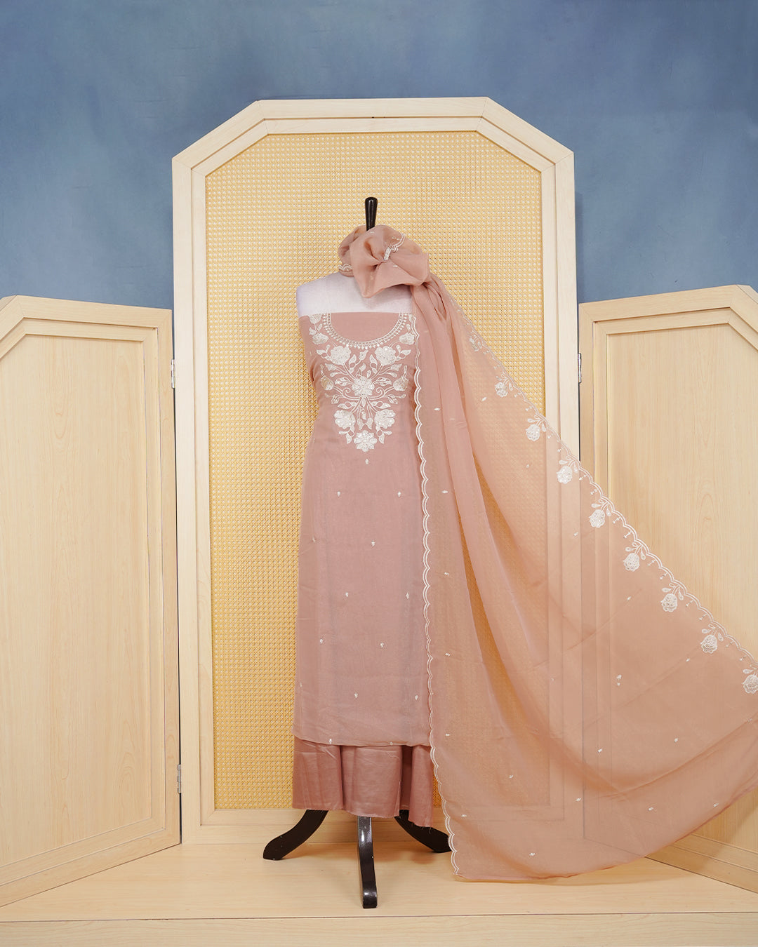 Dusty Rose Georgette Salwar Material Features an Inrcate Floral Emproidary Pattern Aborned With Shimmering Sequin Accents, paired with matching bottom & elegant Duptta