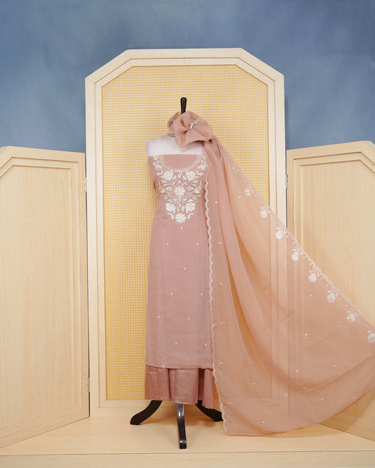 Dusty Rose Georgette Salwar Material Features an Inrcate Floral Emproidary Pattern Aborned With Shimmering Sequin Accents, paired with matching bottom & elegant Duptta