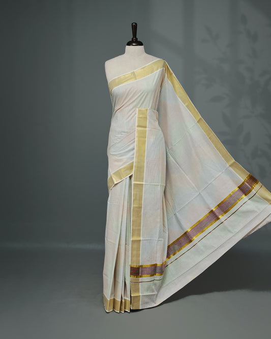 Cream colour Cotton kerala saree featuring Multicolour Strips on body, complemented by Gold zari & multi colour Border, paired with matching blouse piece.