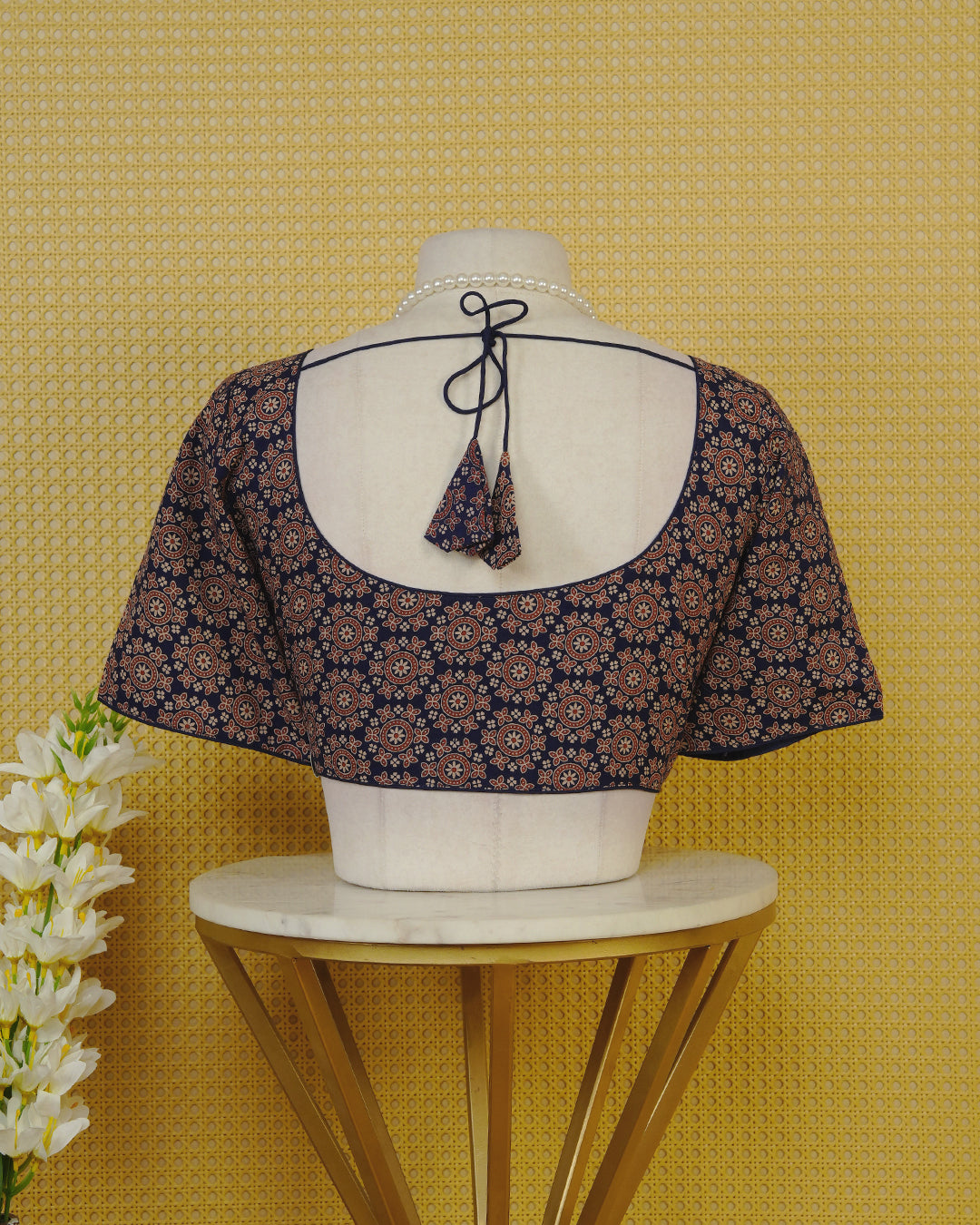 Blue Colour Blouse Featuring A Classic U-Neck, Intricate Floral Geometric Print, And Comfortable Elbow Length Sleeves.