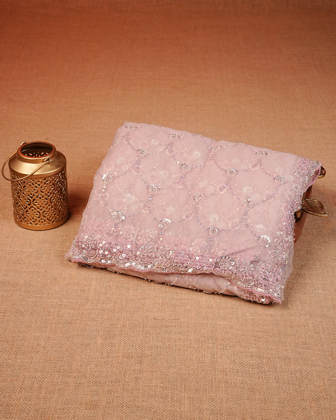 Light pink colour Net Designer saree featuring Beats & Sequins geometric Pattern on body & worked border, comes with matching blouse piece.