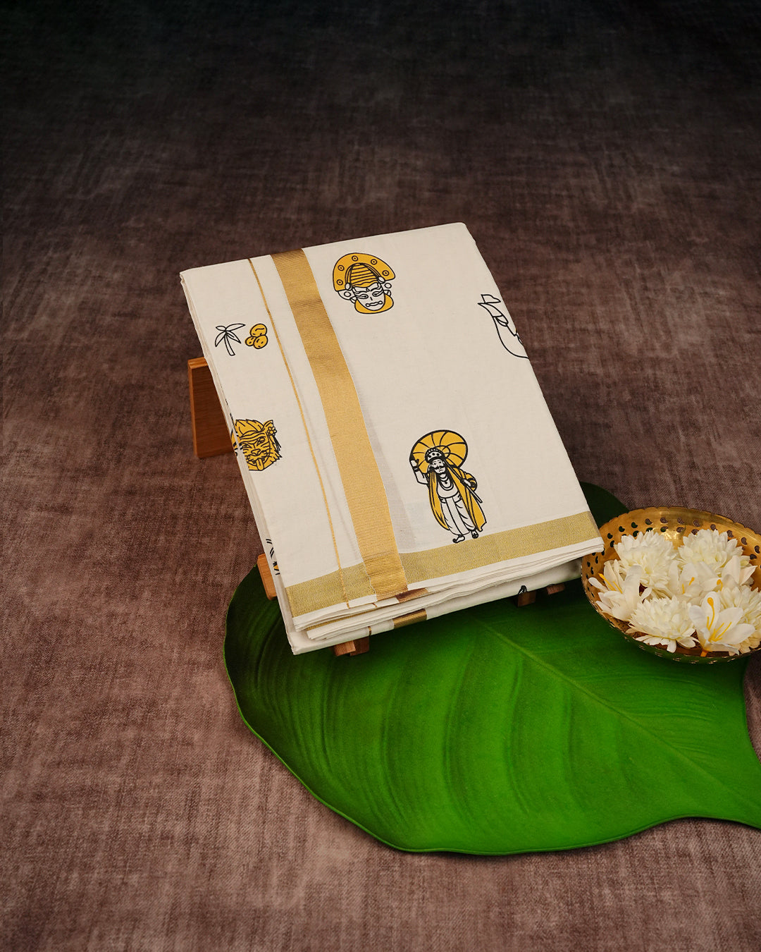 Cream Coloured Cotton Double Dhoti Finished with Onam Themed Prints & Gold Kara