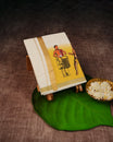 Cream Coloured Cotton Double Dhoti Finished with Onam Themed Prints & Gold Kara