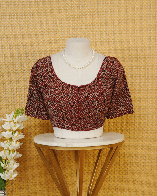 Maroon Colour Blouse Featuring A Classic U-Neck, Intricate Floral Geometric Print, And Comfortable Elbow Length Sleeves.