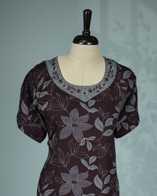 Dark brown floral kodi printed nighty featuring a round embroidered neckline with contrast grey yoke detailing, short sleeves and a comfortable ankle-length fit.