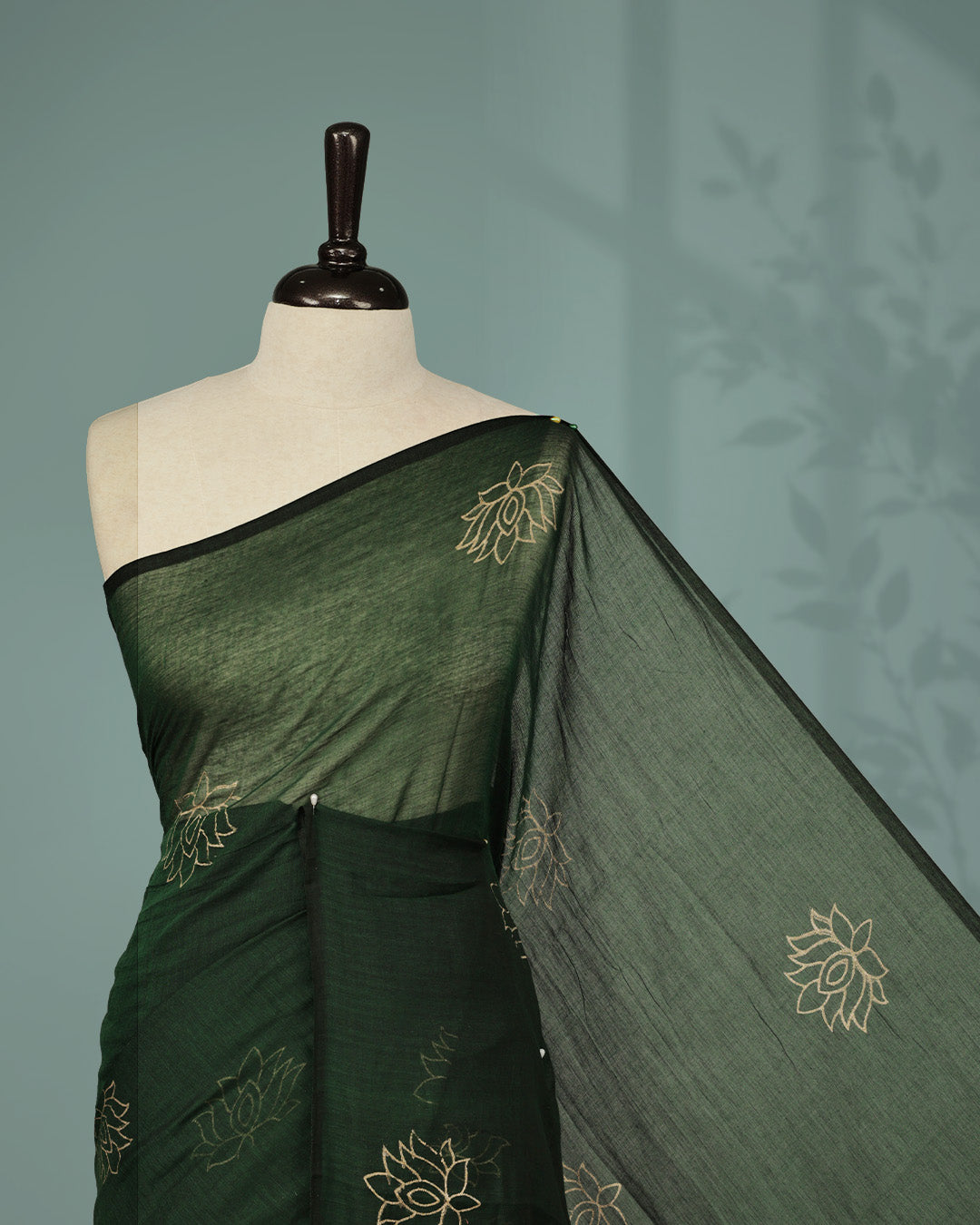 Bottle Green colour pure mul cotton saree featuring Minimal Lotus Print on body, Clean Borderless design, elegant tassels.