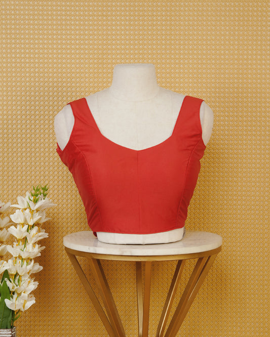 Red colour Sleeveless Blouse Featuring A Stylish Sweetheart Neck, Smooth Finish, And A Comfortable Tailored Fit.