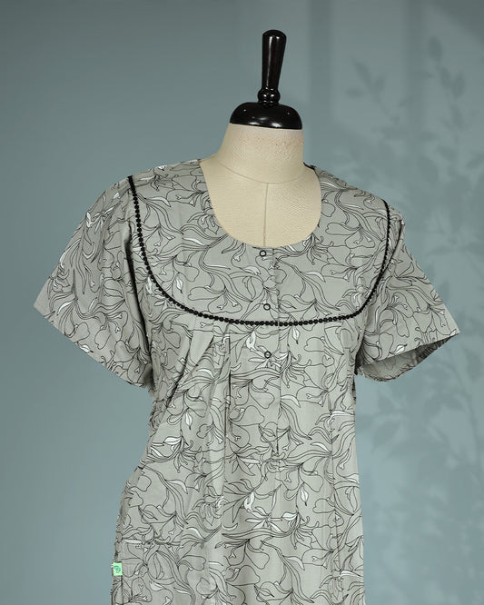 Light Grey colour nighty featuring floral prints on body, an openable button-front round neckline with black lace trim, short sleeves and an ankle-length fit.