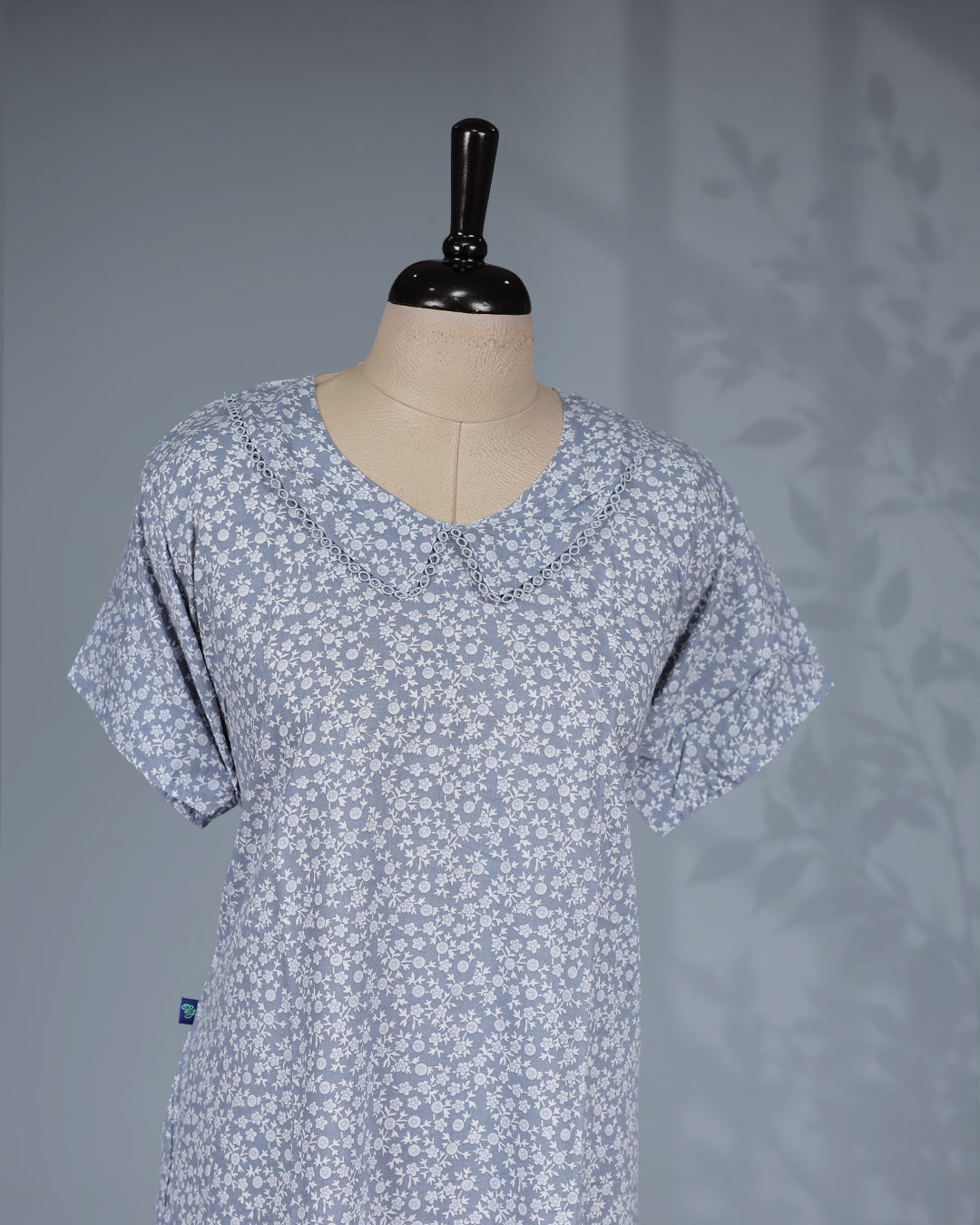 Light Grey floral printed nighty with a classic U-neckline, short sleeves, a delicate scalloped Peter Pan collar, and a relaxed midi-length for everyday comfort and charming style.