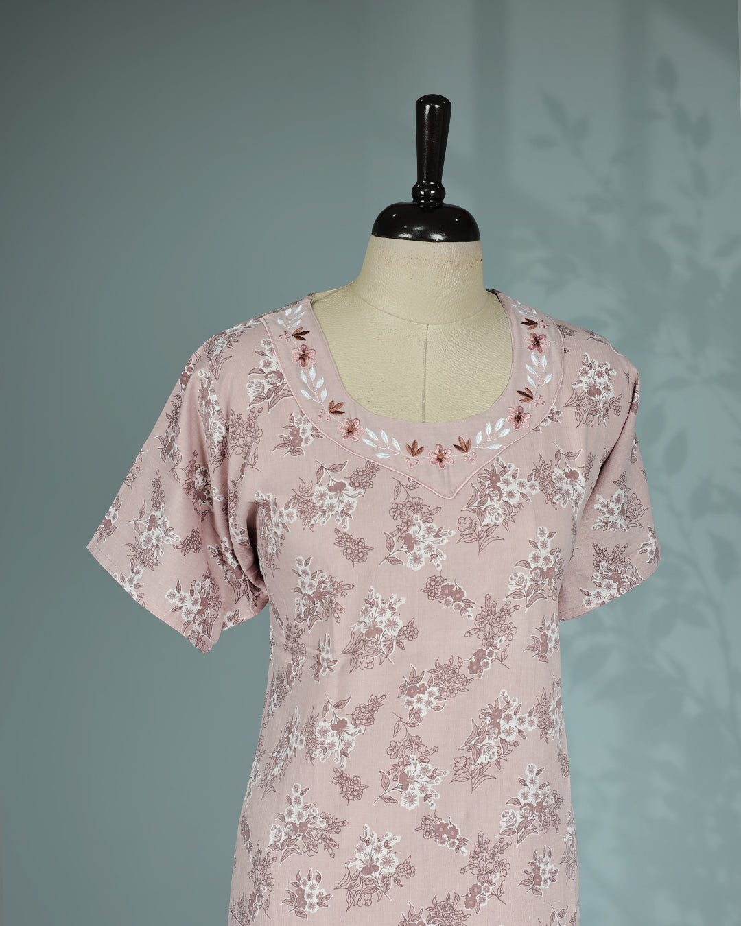 Dusty pink floral kodi  printed nighty with a classic U-shaped neckline, short sleeves, delicate floral embroidery along the neckline, and a relaxed full-length for everyday comfort and graceful style.