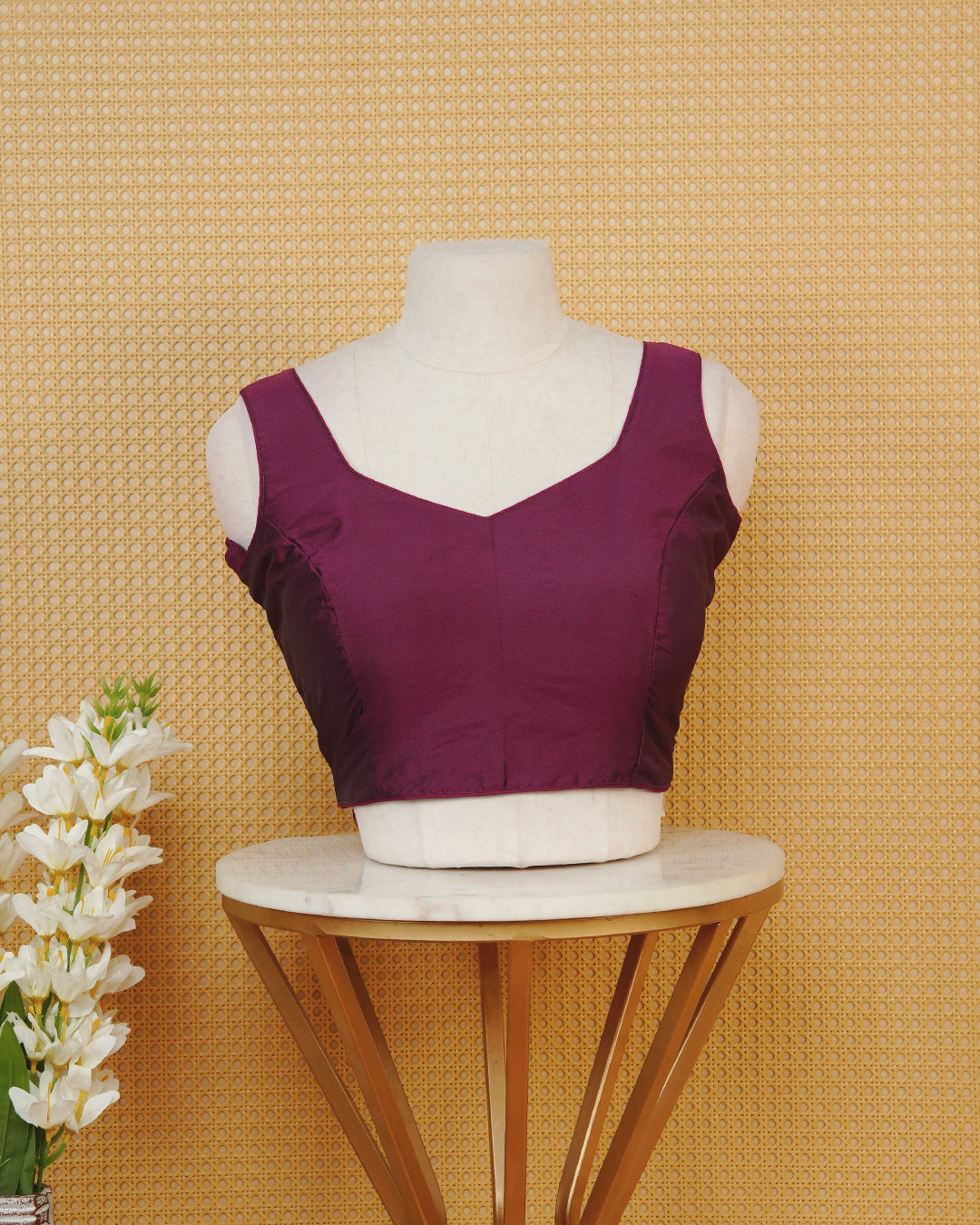 Burgundy colour Sleeveless Blouse Featuring A Stylish Sweetheart Neck, Smooth Finish, And A Comfortable Tailored Fit.