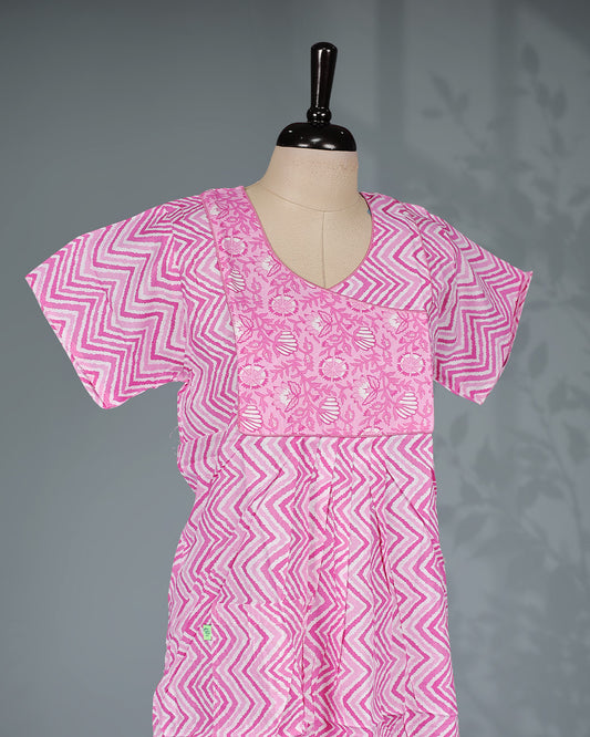 Pink colour nighty featuring a zigzag print with a floral yoke, a round neckline, short sleeves and an ankle-length fit.