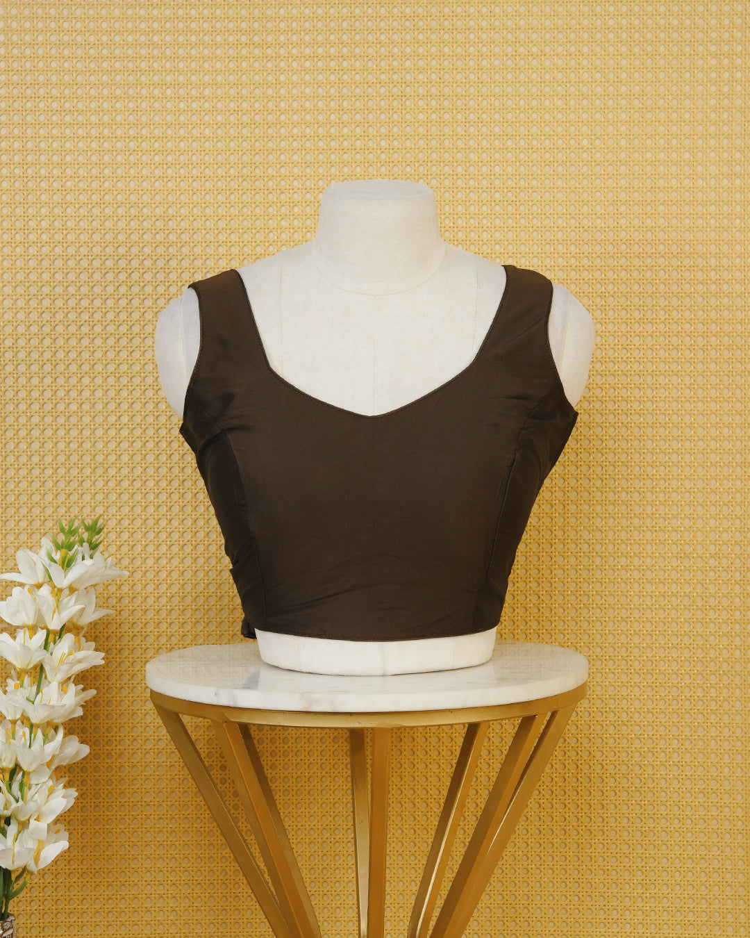 Brown colour Sleeveless Blouse Featuring A Stylish Sweetheart Neck, Smooth Finish, And A Comfortable Tailored Fit.