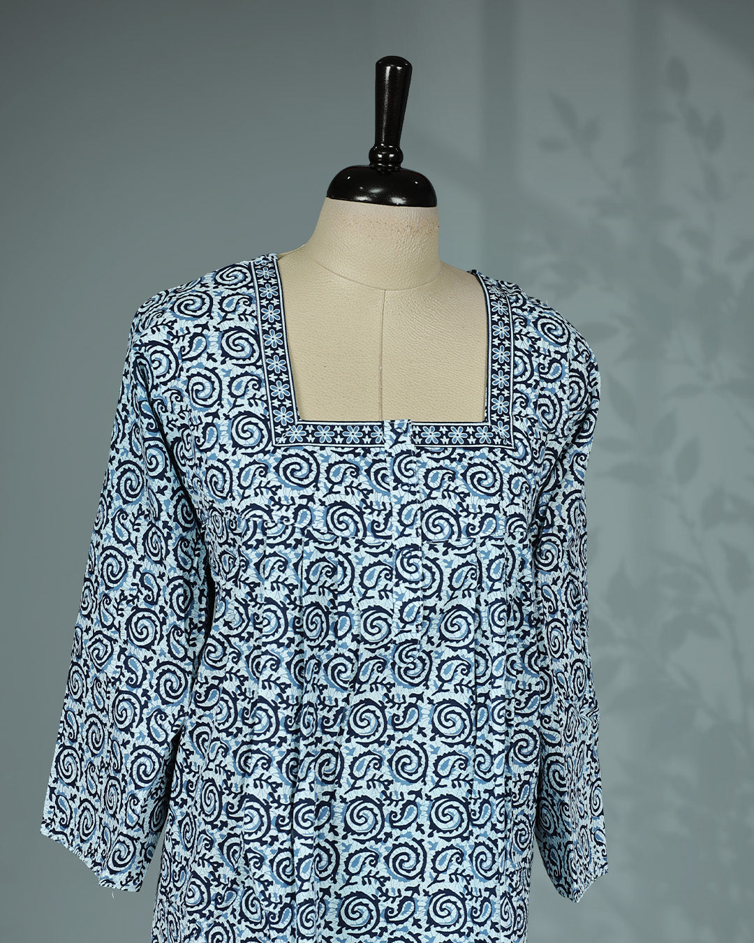 Blue and white printed nighty featuring  elegant square neckline with contrast printed border, three-quarter sleeves and a relaxed full-length fit for comfort.