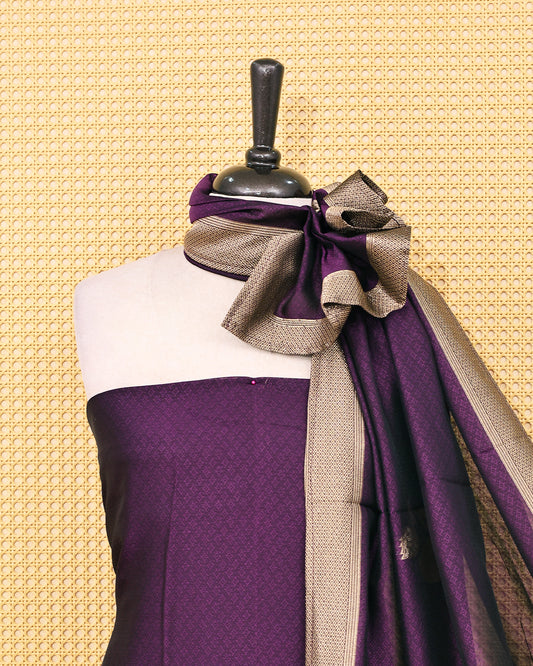 Purple colour Banaras salwar material featuring Zari floral work on body, paired with Matching bottom & dupatta.