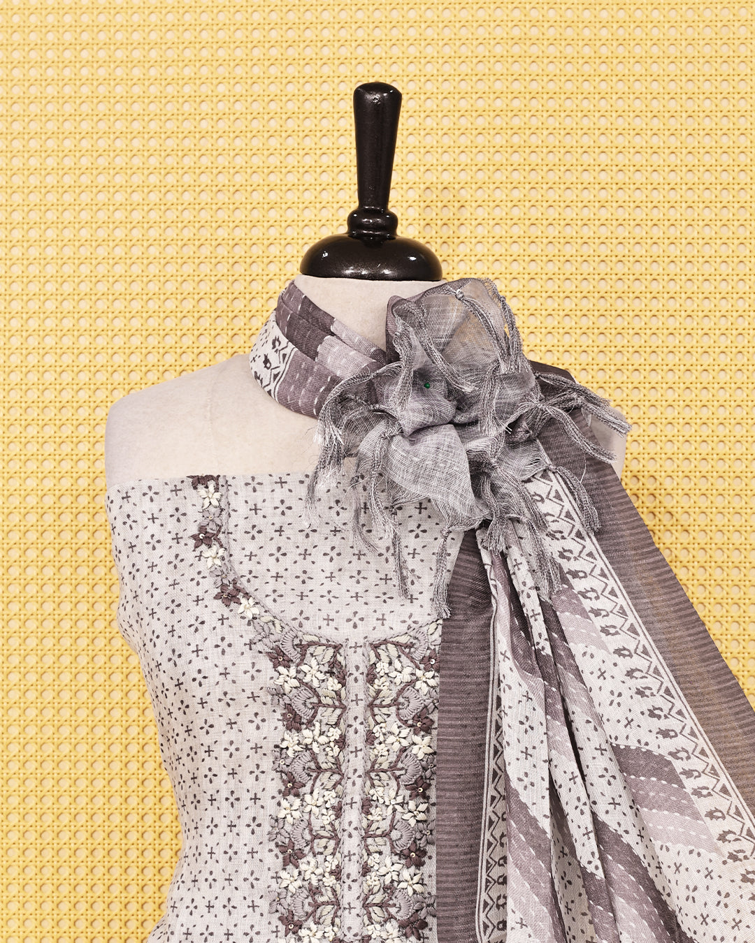 Off White colour Linen salwar material featuring Thread work with print on body, paired with Contrast Greyish beige colour bottom & dupatta.
