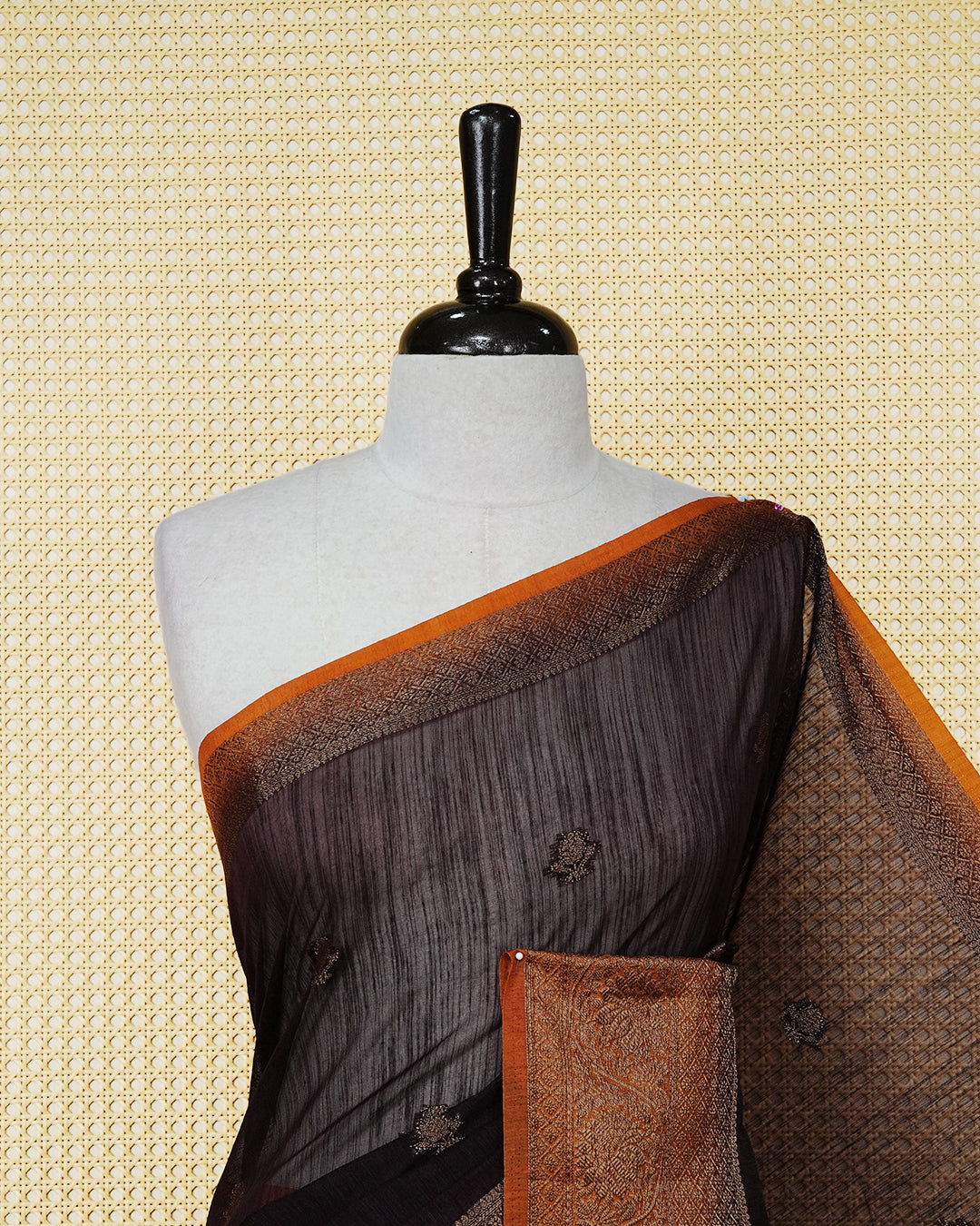 Dark brown colour semi linen saree thread motifs on body, contrast mustard orange colour gold zari border, rich pallu comes with matching blouse piece