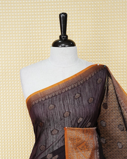 Dark brown colour semi linen saree thread motifs on body, contrast orange colour gold zari border, rich pallu comes with matching blouse piece