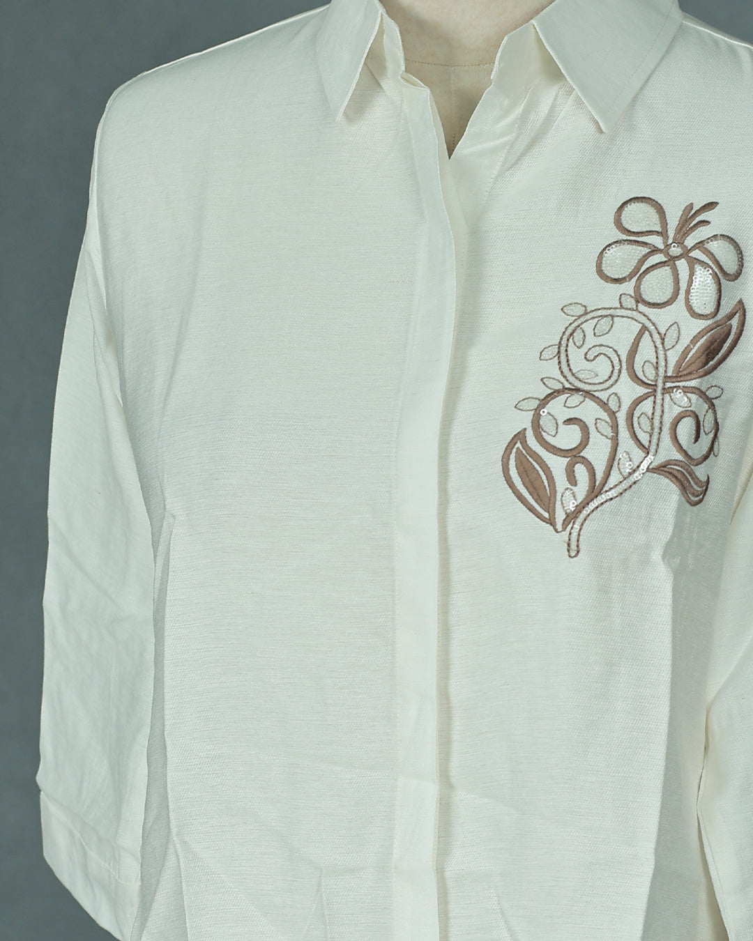 Cream colour Top with Thread Print work on body, collar design, With sleeve.