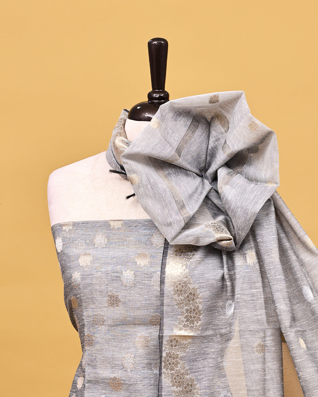 Grey colour linen Salwar material with Gold zari kodi pattern on body, matching bottom & Dupatta.