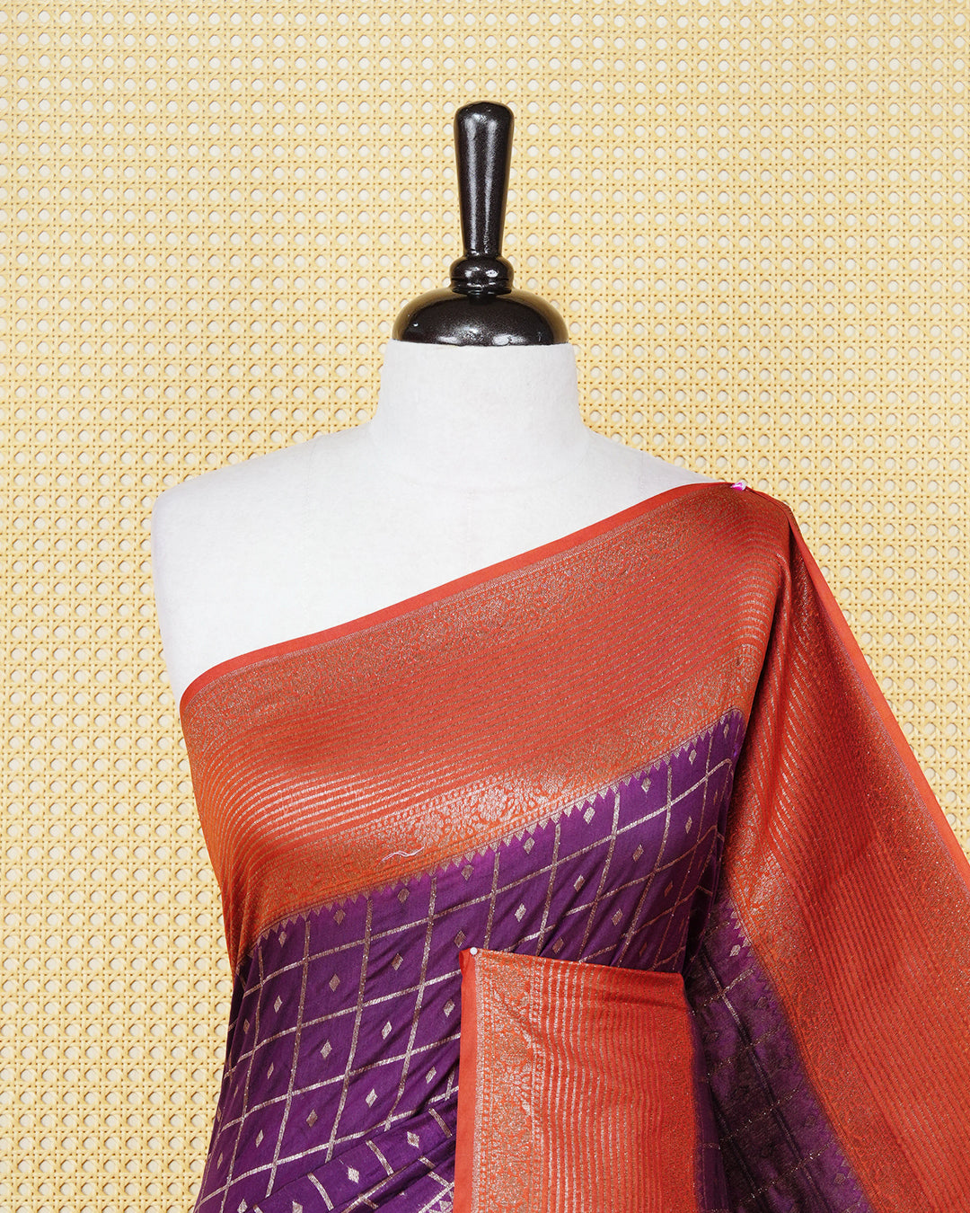 Grape Colour Semi georgette Saree having zari check with buttas pattern on body, contrast rust orange colour floral designed border, Rich Pallu comes with Matching Blouse piece.