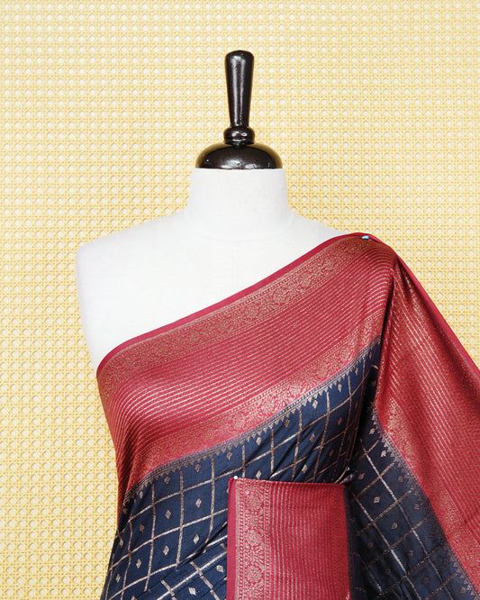 Navy blue Colour Semi georgette Saree having zari check with buttas pattern on body, contrast maroon colour floral designed border, Rich Pallu comes with Matching Blouse piece.