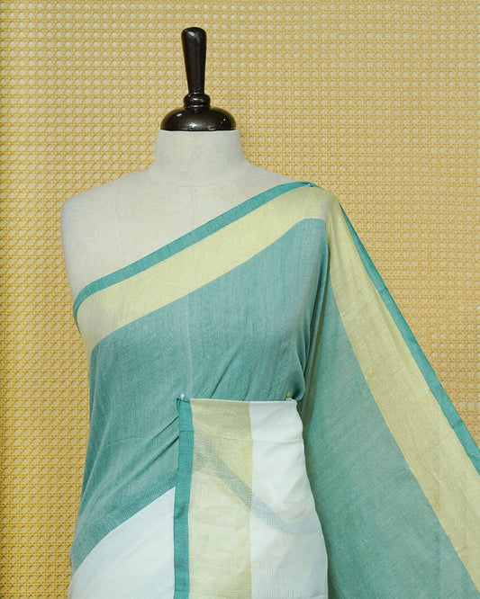 Sea Green & White Colour Half & Half Mul cotton saree Complemented by contrast colour Gold Zari Border & tassels.