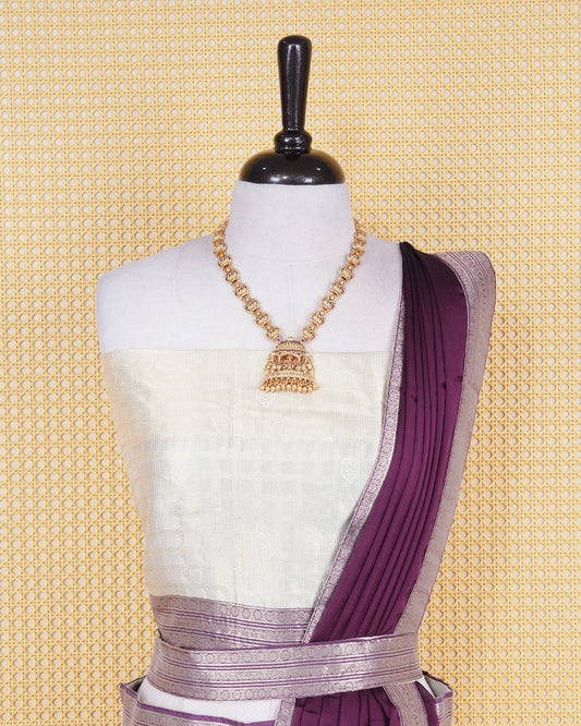 Cream colour tissue Semi stitched dhavani set featuring Gold zari check pattern with motifs on body ,contrast Purple colour with gold zari bordered skirt, paired with matching blouse piece & dupatta.
