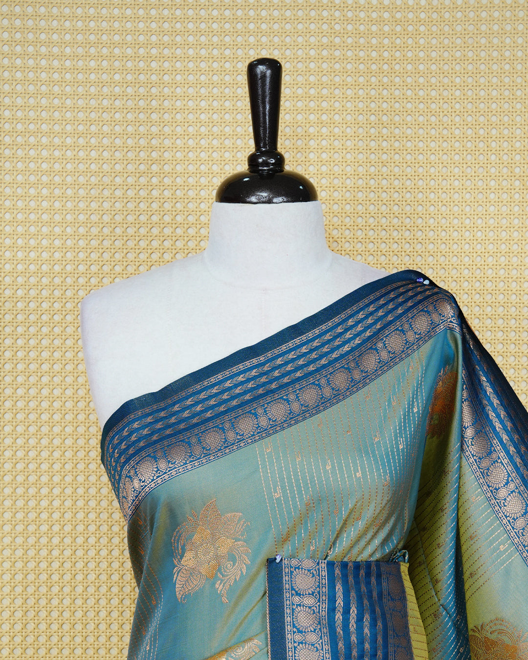 Green & gold double shade Mulberry silk saree featuring floral gold zari patterns on body , paired with contrast teal colour with traditional border, comes with matching blouse piece.