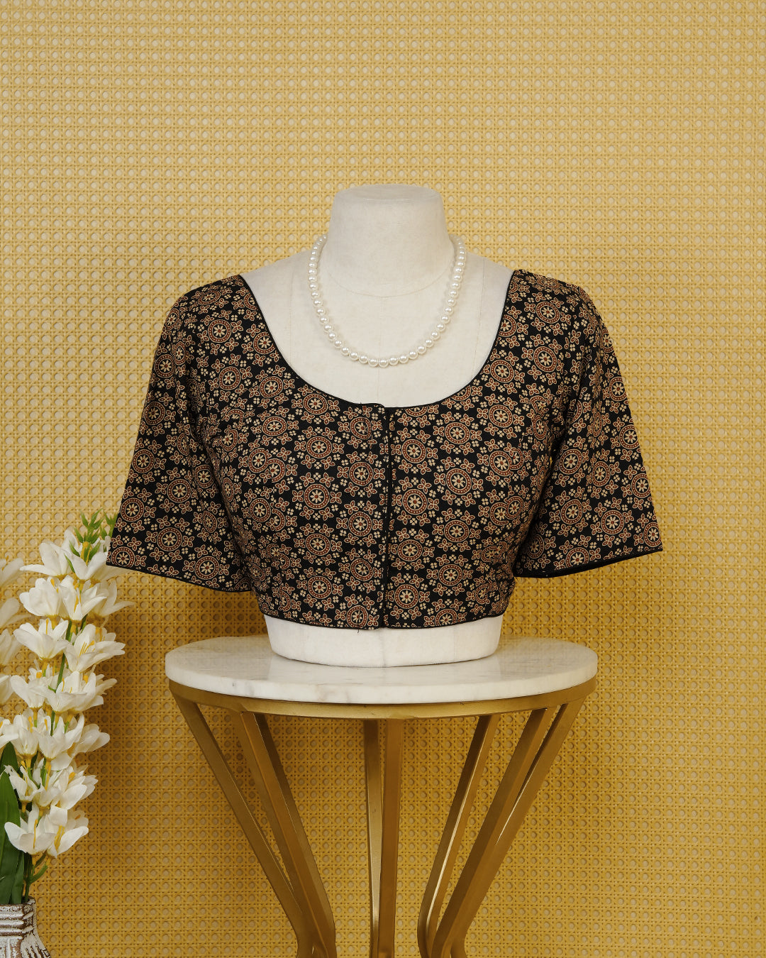 Black Colour Blouse Featuring A Classic U-Neck, Intricate Floral Geometric Print, And Comfortable Elbow Length Sleeves.