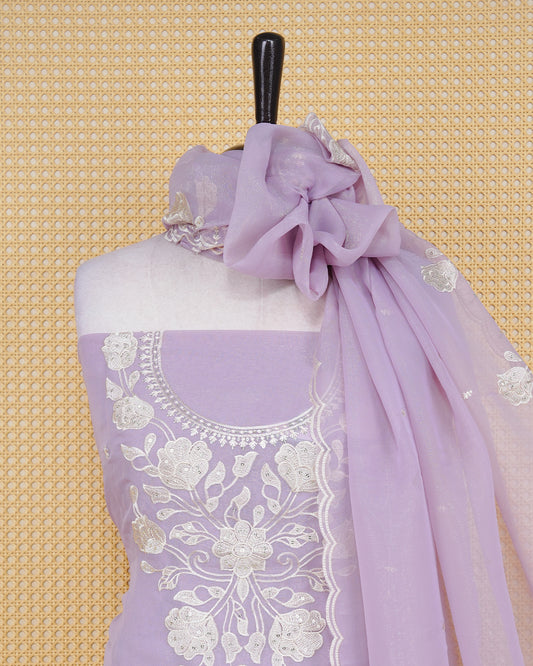 Lavender Pink Georgette Salwar Material featuring an intricate floral embroidery pattern adorned with shimmering sequin accents, paired with a matching bottom and an elegant dupatta.