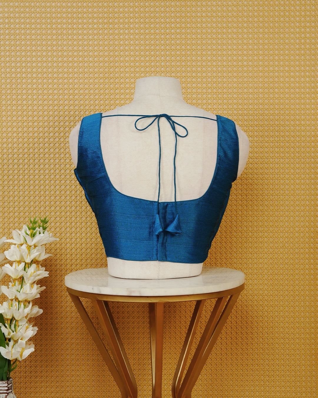 Blue colour Sleeveless Blouse Featuring A Classic Scoop Neck, Smooth Finish, And A Comfortable Tailored Fit.