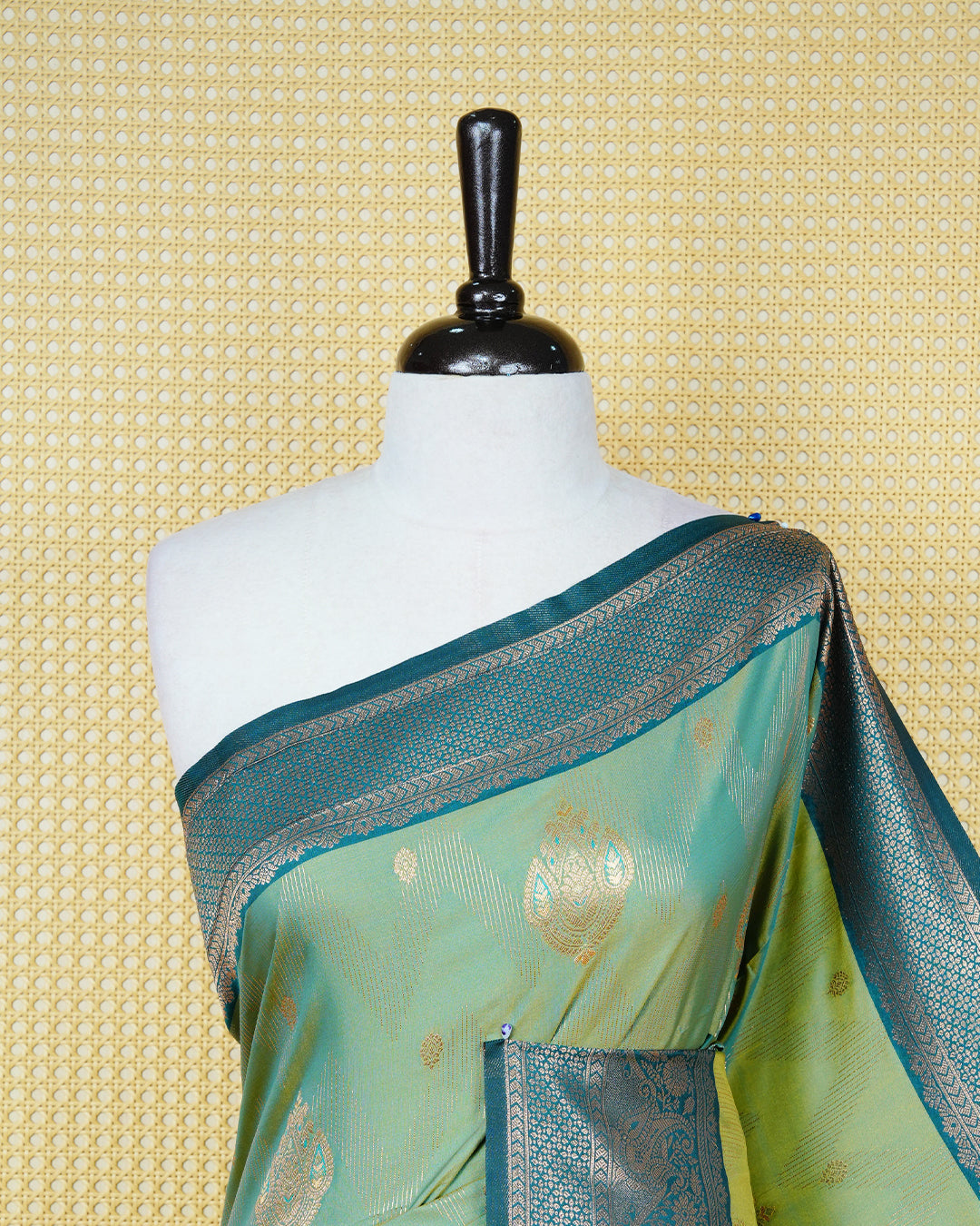 Green & gold double shade Mulberry silk saree featuring gold zari patterns on body , paired with contrast teal colour with traditional border, comes with matching blouse piece.