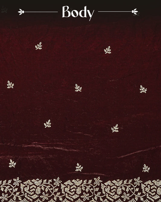 Maroon colour Velvet chiffon designer saree featuring delicate stone motifs on body and stone worked border, comes with matching blouse piece.