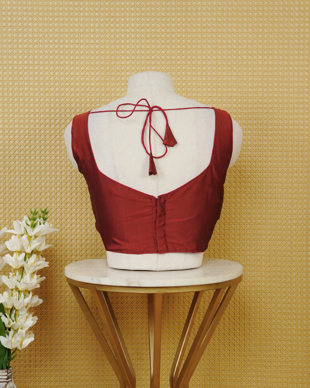 Dark red colour Sleeveless Blouse Featuring A Stylish Sweetheart Neck, Smooth Finish, And A Comfortable Tailored Fit.