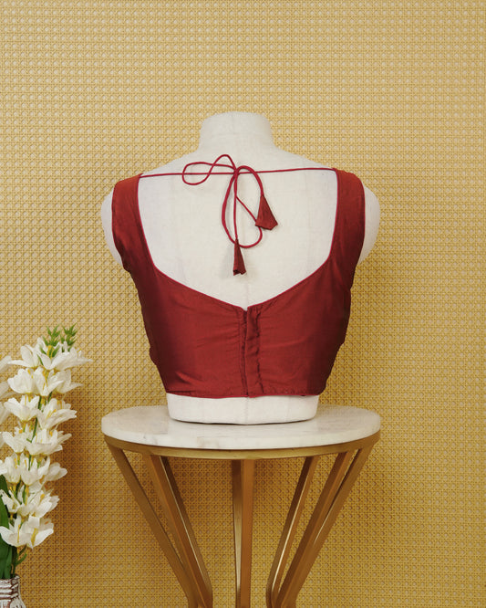 Dark red colour Sleeveless Blouse Featuring A Stylish Sweetheart Neck, Smooth Finish, And A Comfortable Tailored Fit.
