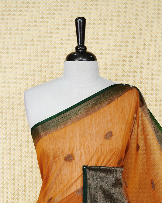 Mustard yellow colour semi linen saree thread motifs on body, contrast dark green colour gold zari border, rich pallu comes with matching blouse piece