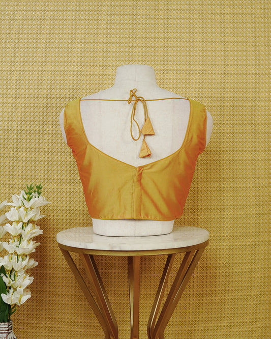 Mustard Yellow colour Sleeveless Blouse Featuring A Stylish Sweetheart Neck, Smooth Finish, And A Comfortable Tailored Fit.