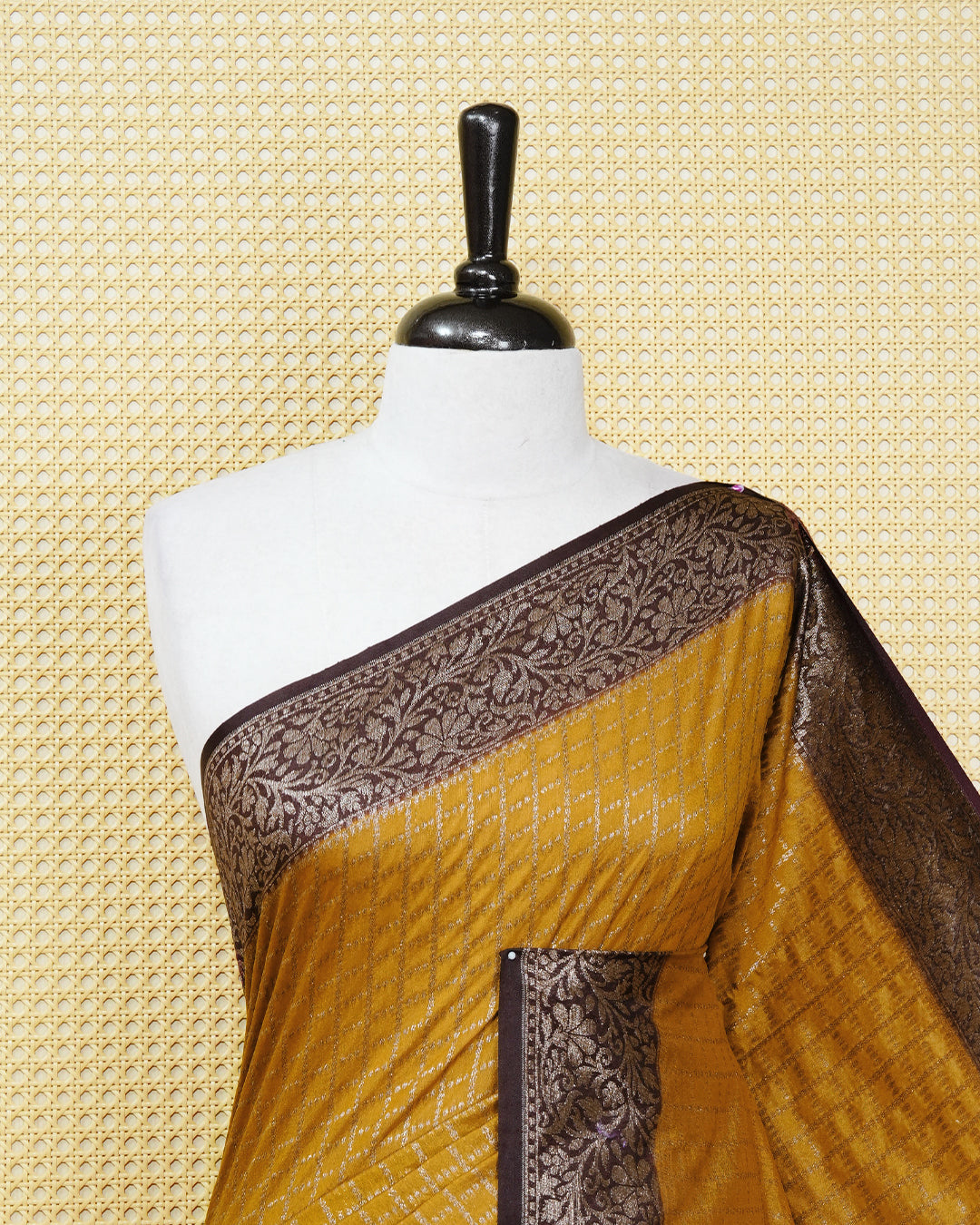 Mustard yellow Colour Semi georgette Saree having zari dotted check pattern on body, contrast dark coffee browncolour floral kodi designed Border, Rich Pallu comes with Matching Blouse piece.