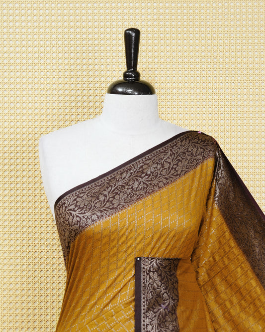Mustard yellow Colour Semi georgette Saree having zari dotted check pattern on body, contrast dark coffee browncolour floral kodi designed Border, Rich Pallu comes with Matching Blouse piece.