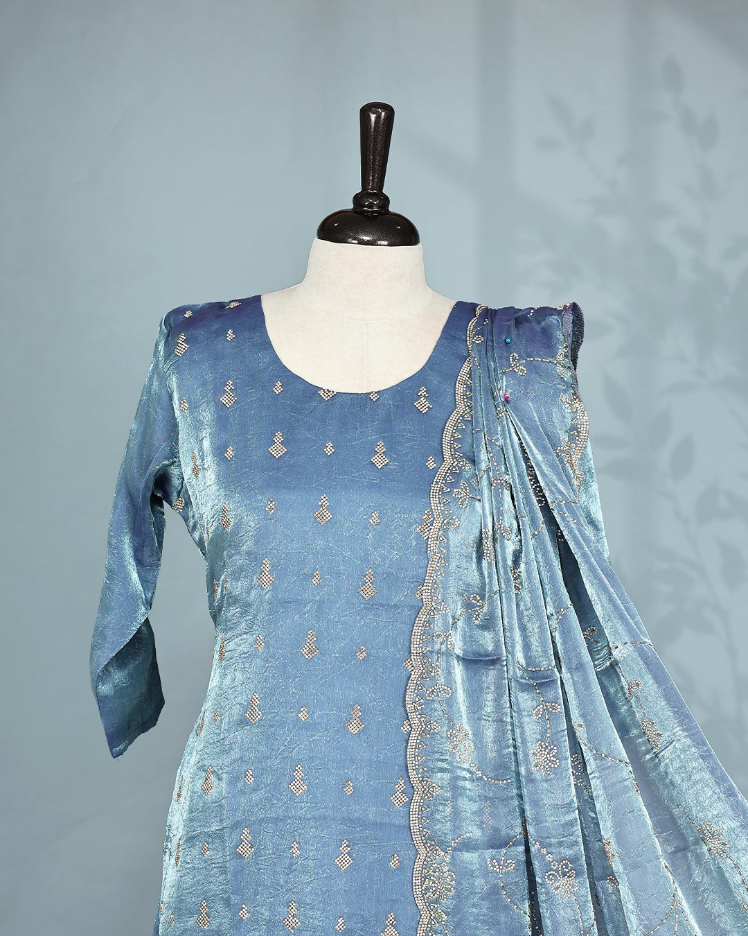 Steel colour Salwar set comes top with Stone work on body, paired with matching bottom and dupatta.