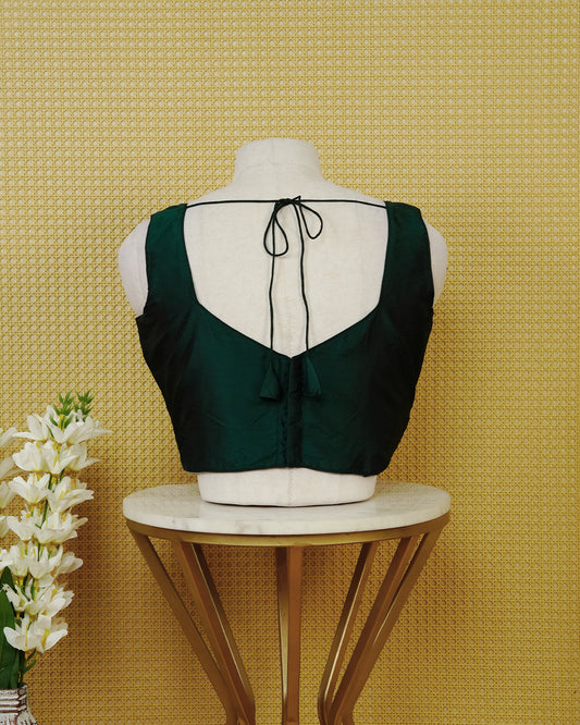 Green colour Sleeveless Blouse Featuring A Stylish Sweetheart Neck, Smooth Finish, And A Comfortable Tailored Fit.