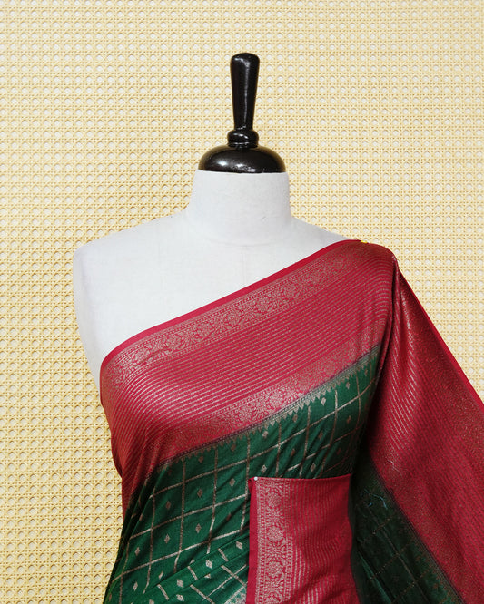 Dark green Colour Semi georgette Saree having zari check with buttas pattern on body, contrast red colour floral designed border, Rich Pallu comes with Matching Blouse piece.