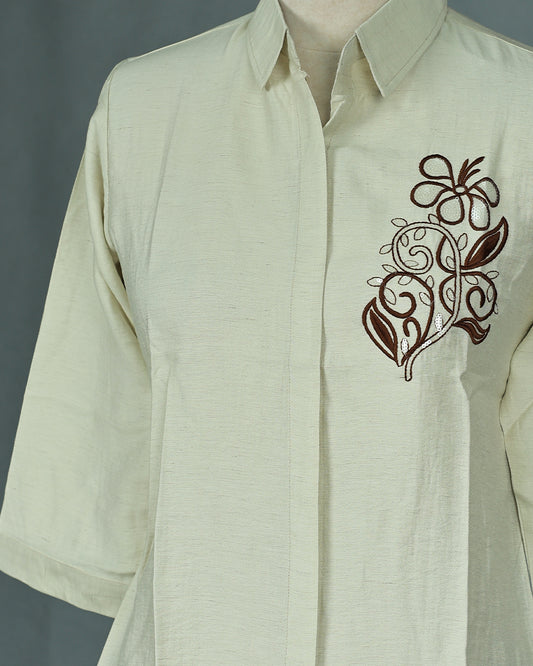 Cream colour Top with Thread work on body, collar design, With sleeve.
