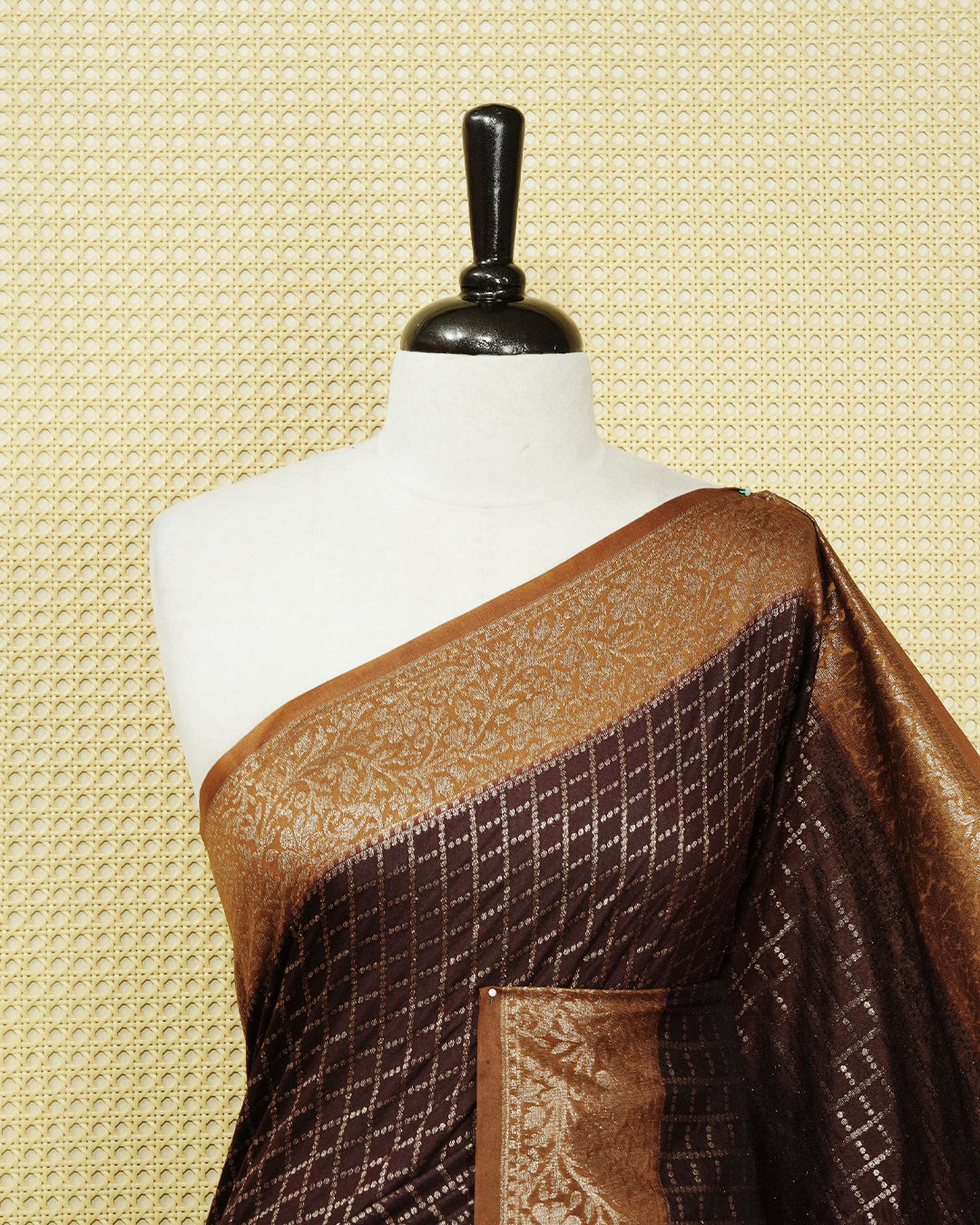 Dark coffee brown Colour Semi georgette Saree having zari dotted check pattern on body, contrast dark mustard colour floral kodi designed Border, Rich Pallu comes with Matching Blouse piece.