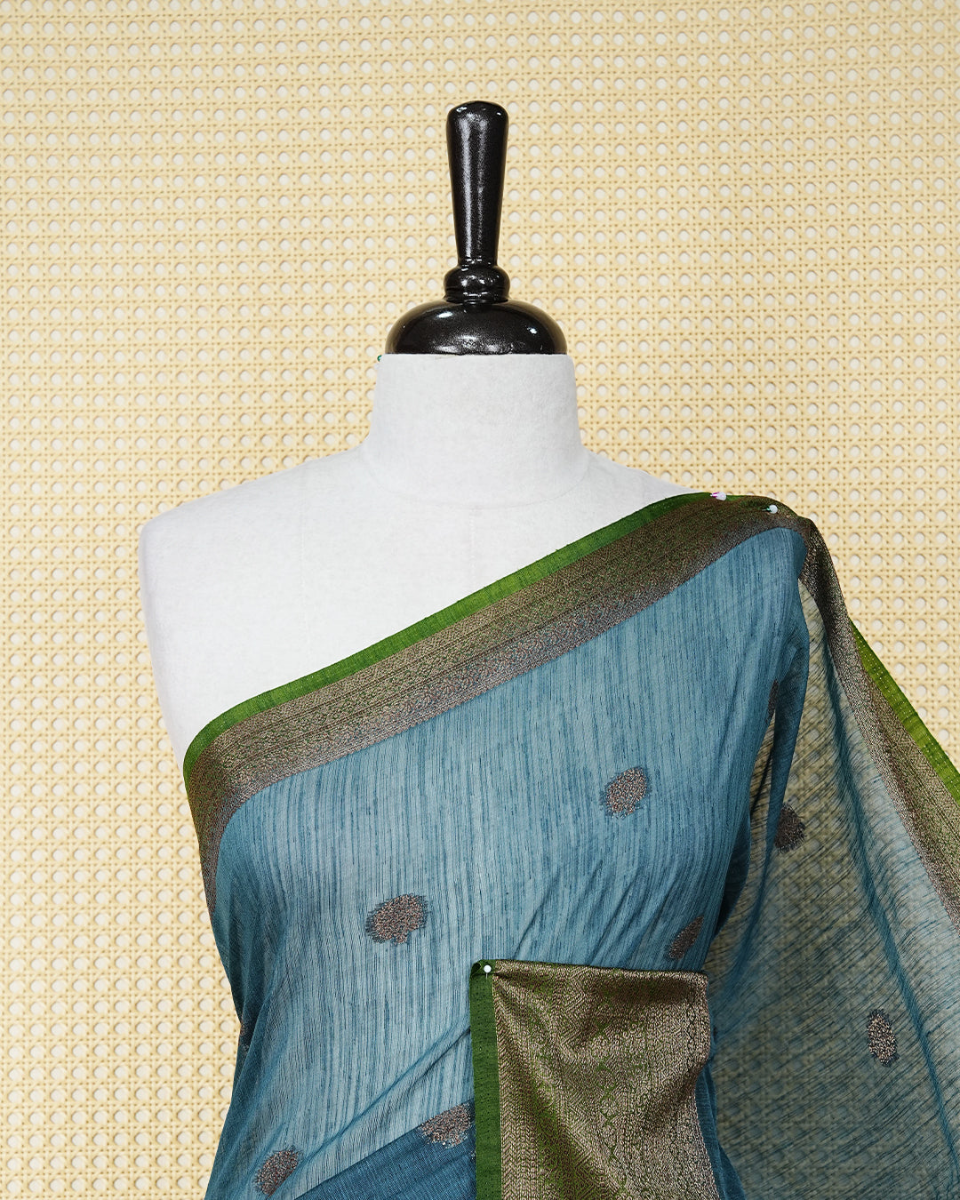 Dark teal colour semi linen saree thread motifs on body, contrast mehndi green colour gold zari border, rich pallu comes with matching blouse piece
