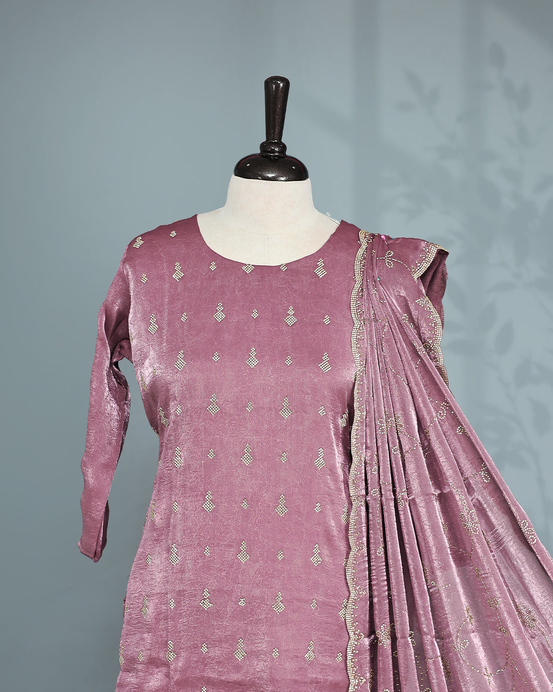 Mauve colour salwar set with Stone work on top, paired with matching bottom & Dupatta.