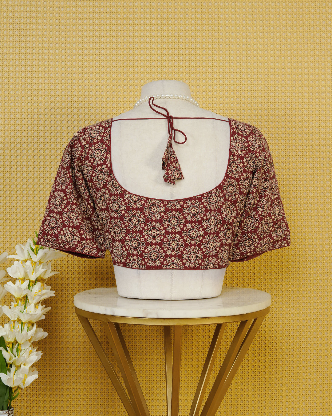 Maroon Colour Blouse Featuring A Classic U-Neck, Intricate Floral Geometric Print, And Comfortable Elbow Length Sleeves.